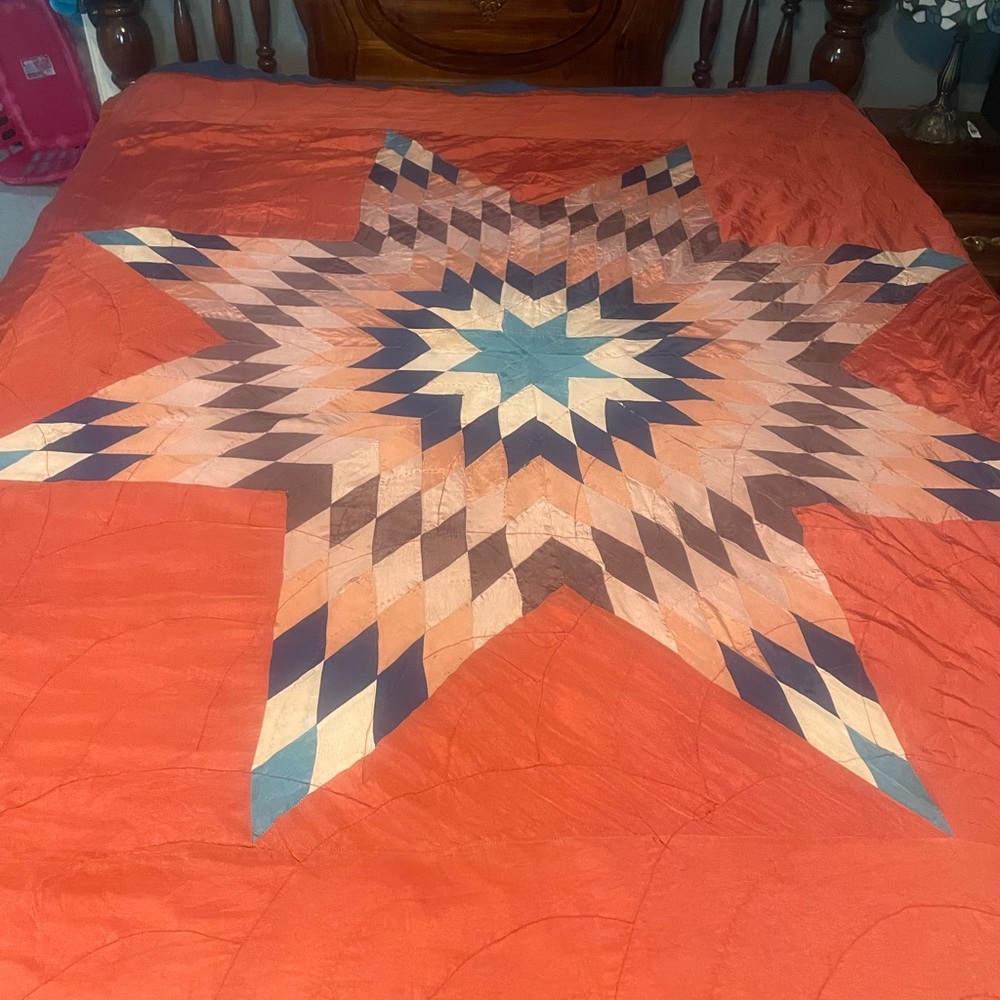 Vibrant Starburst Quilt in Orange and Blue
